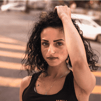 Michelle in athletic clothes standing outside Michelle in athletic clothes standing outside